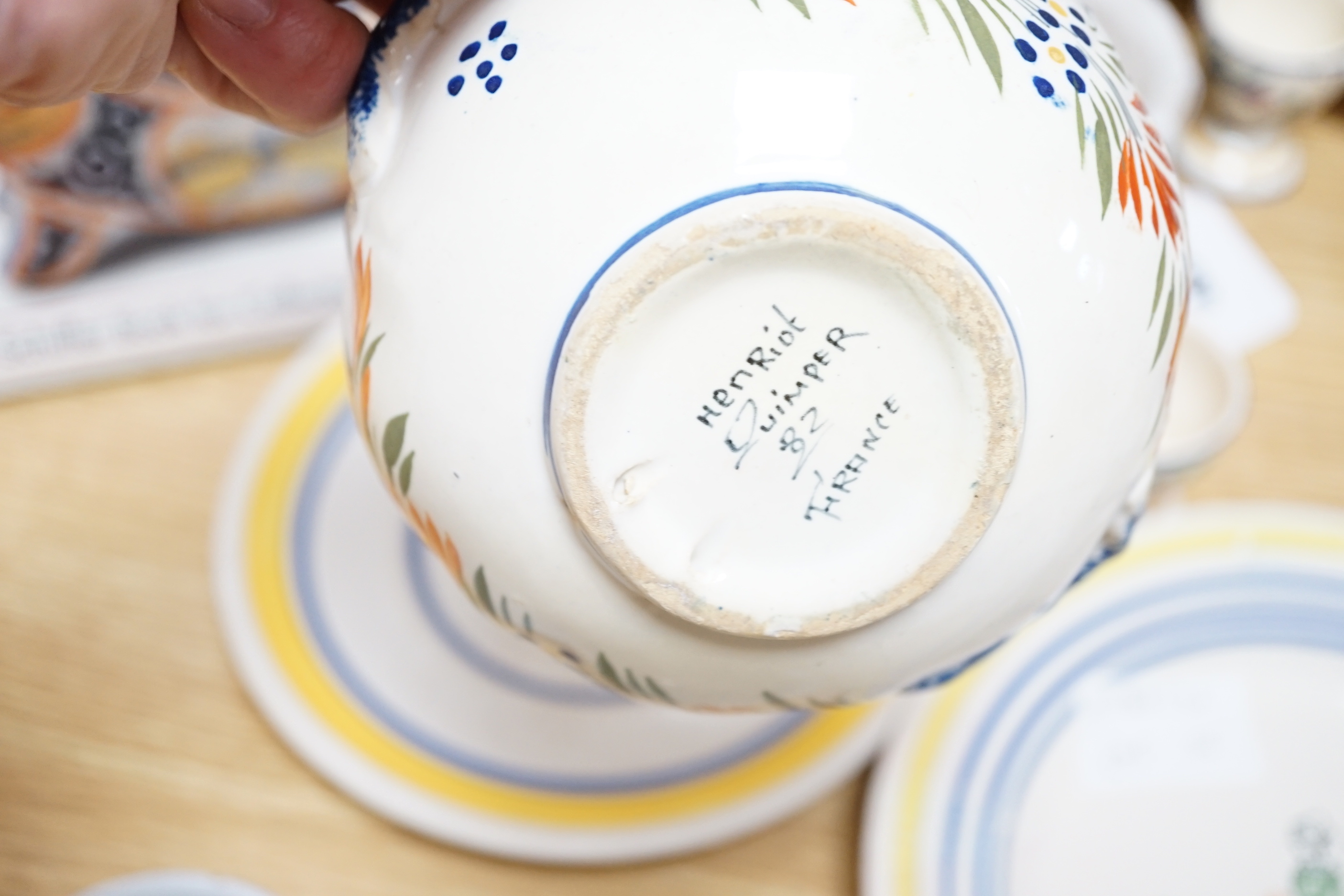 A group of Quimper pottery and a Quimper Pottery book by Angela Meadows